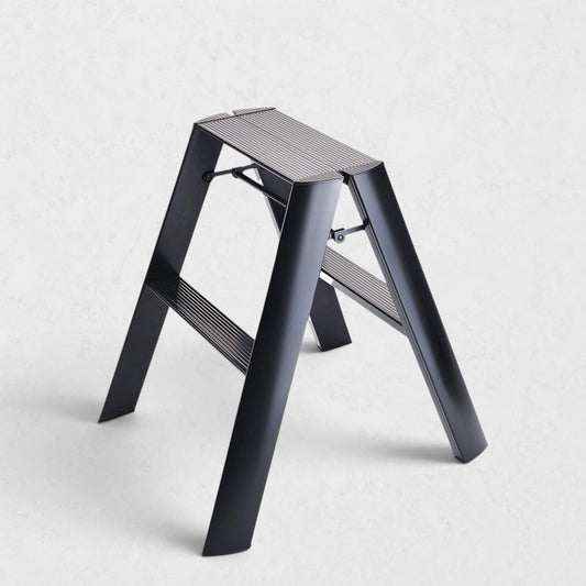 Hudson Grace black Hasegawa Lucano 2-step ladder with a matte finish, grooved treads, and a slim folding design.