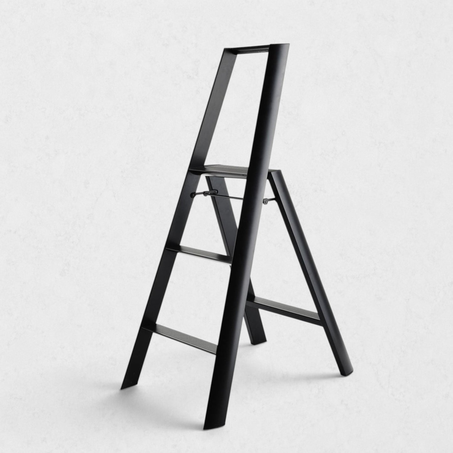 Hudson Grace Hasegawa Lucano 3-step ladder in matte black aluminum and steel with a minimalist folding design.