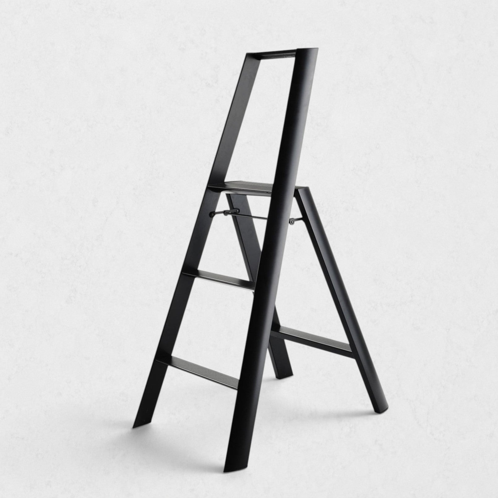 Hudson Grace Hasegawa Lucano 3-step ladder in matte black aluminum and steel with a minimalist folding design.