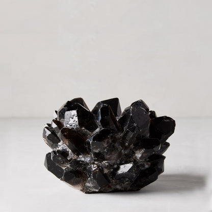Black petite quartz votive candle holder, 5"Dia x 3"H, made from genuine dark quartz crystals.