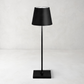 Black Poldina Pro rechargeable LED lamp with a sleek, modern design and conical shade.