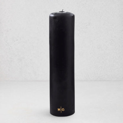 HG Black Unscented Pillar Candle, 3"x12", with gold HG logo and oversized cotton wick.