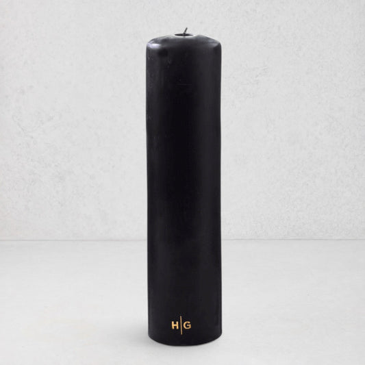HG Black Unscented Pillar Candle, 3"x12", with gold HG logo and oversized cotton wick.