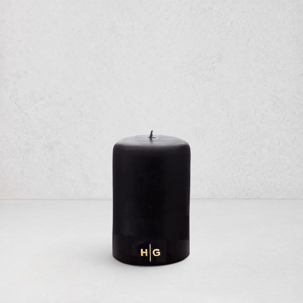 HG Black Unscented Pillar Candle, 3"x4", with gold HG logo, oversized cotton wick.