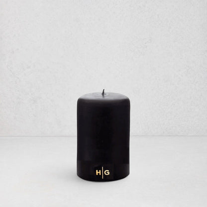 HG Black Unscented Pillar Candle, 3"x4", with gold HG logo, oversized cotton wick.