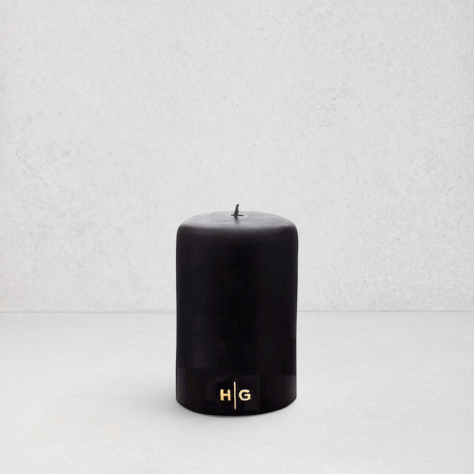 HG Black Unscented Pillar Candle, 3"x4", with gold HG logo, oversized cotton wick.