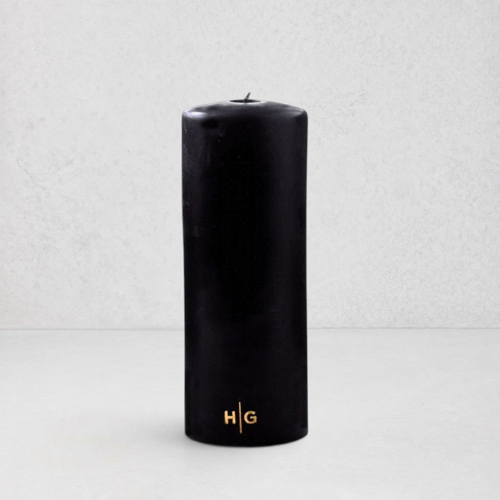 HG Black Unscented Pillar Candle, 3"x8", with gold embossed HG logo.
