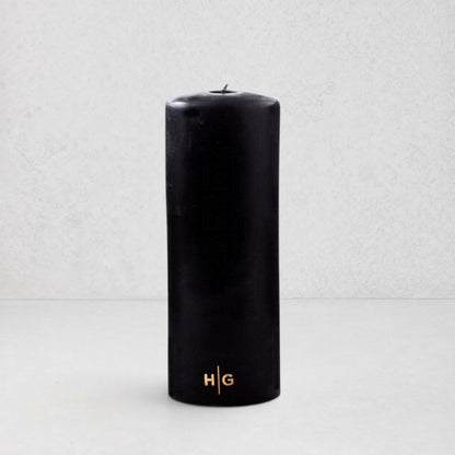 HG Black Unscented Pillar Candle, 3"x8", with gold embossed HG logo.