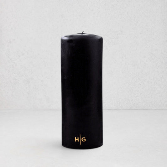 HG Black Unscented Pillar Candle, 3"x8", with gold embossed HG logo.