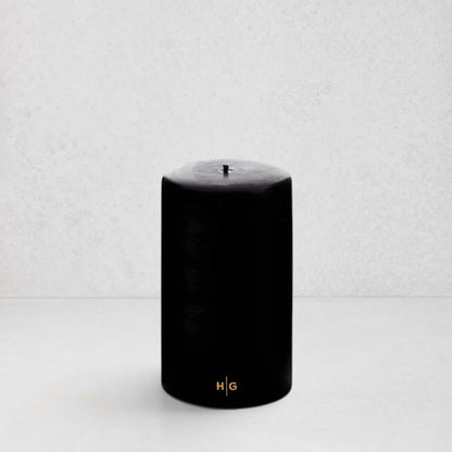 HG Black Unscented Pillar Candle, 4"x6", with gold HG logo.