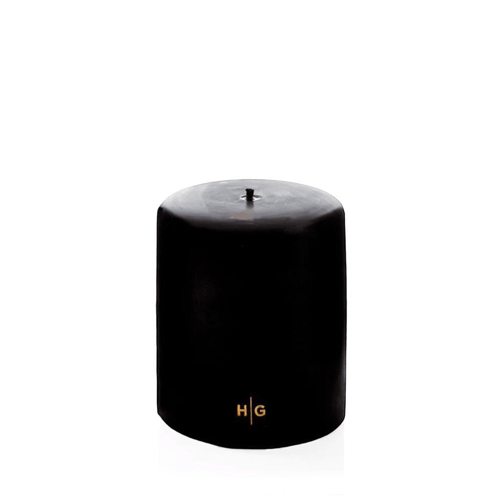 HG Black Unscented Pillar Candle, 5"x6", hand-dipped paraffin with gold HG logo.