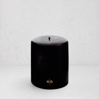 HG Black Unscented Pillar Candle, 5"x6", with gold HG logo and oversized cotton wick.