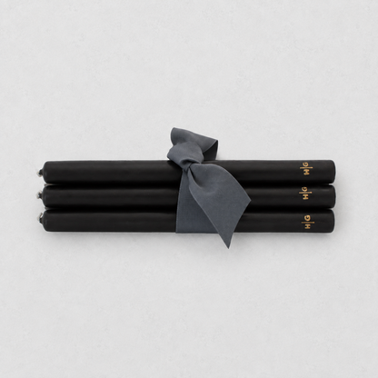 Set of five 10-inch black unscented taper candles tied with a grey ribbon, featuring a gold embossed Hudson Grace logo.
