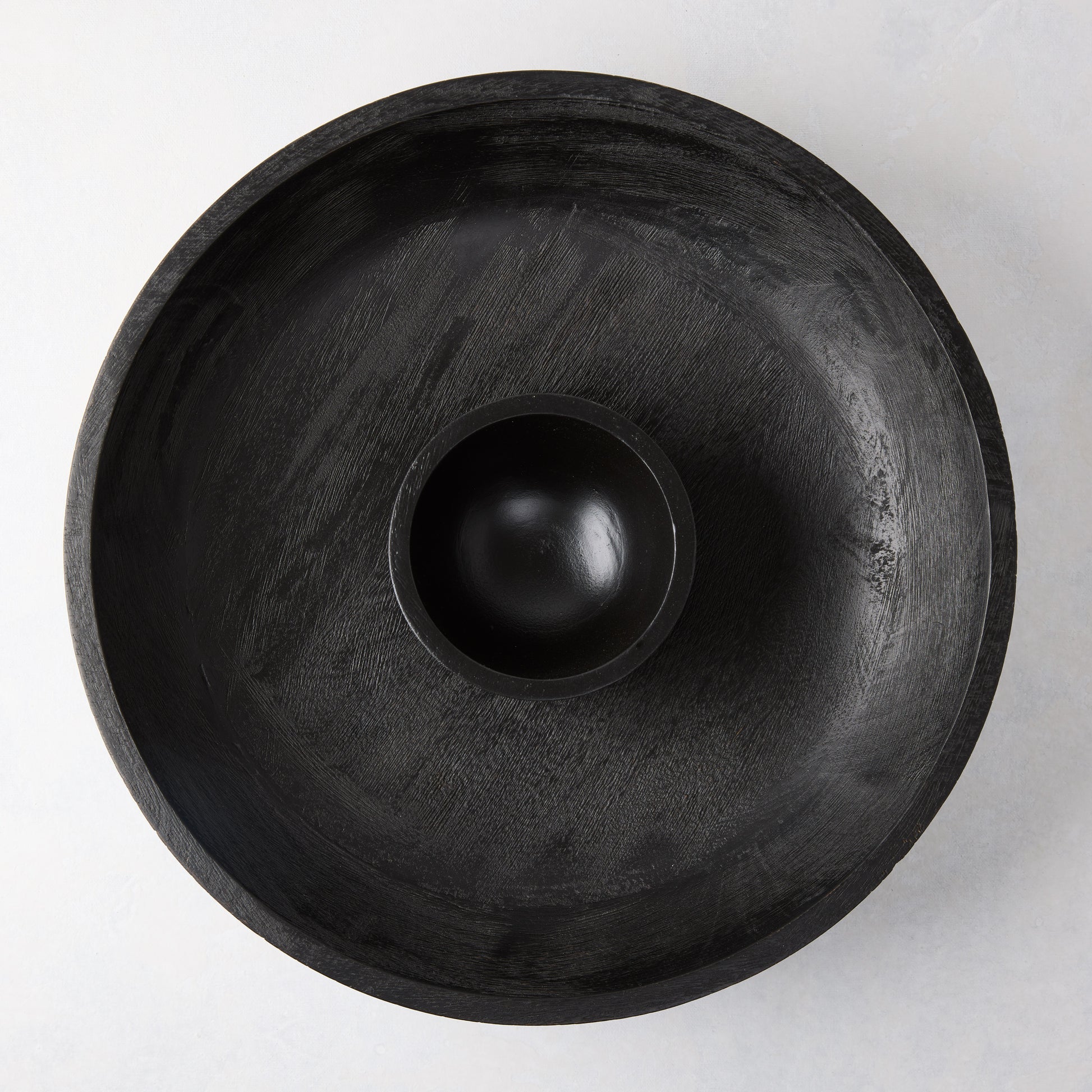 Black 15"Dia mango wood chip and dip platter with built-in dipping bowl.