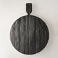 Black round footed serve board with handle, hand-carved European pine wood, 19.7 x 15 x 3.3".