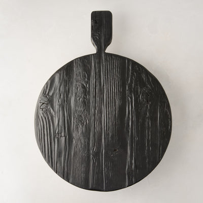 Black round footed serve board with handle, hand-carved European pine wood, 19.7 x 15 x 3.3".