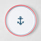 White melamine 8" salad plate with a navy blue anchor and red border.