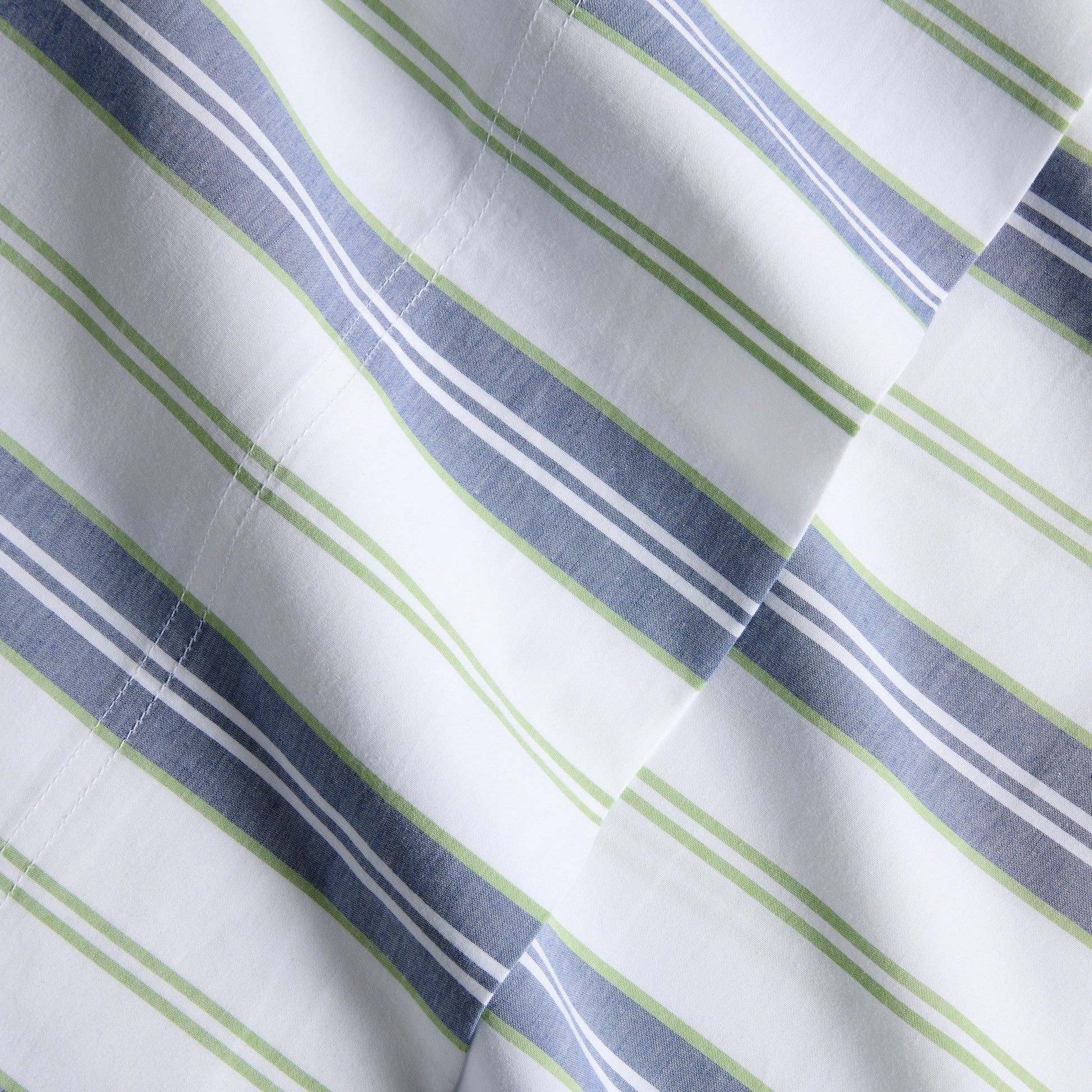 Blue and green multi-stripe percale sheet set, woven from extra-long staple cotton.