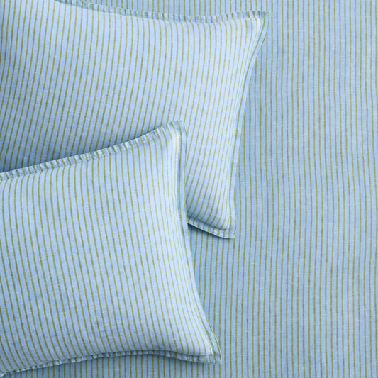 Two blue and green striped European washed linen euro shams on matching striped bedding.