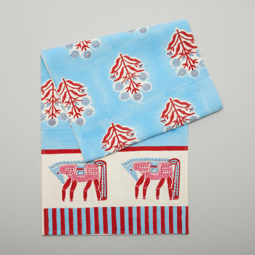 Blue and red horse block print cotton runner with floral motifs and striped border.
