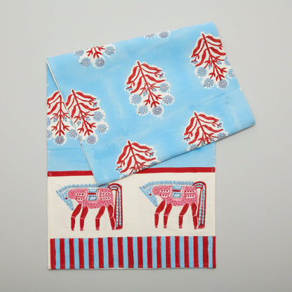 Blue and red horse block print cotton runner with floral motifs and striped border.