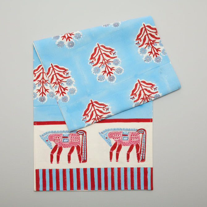 Blue and red horse block print cotton runner with floral motifs and striped border.