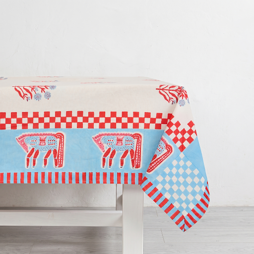 Blue and red horse block print cotton tablecloth with floral motifs and checkered trim.