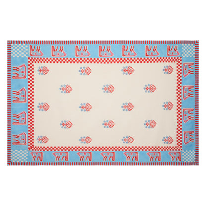 Blue and red horse block print cotton tablecloth with floral motifs and bright blue trim.