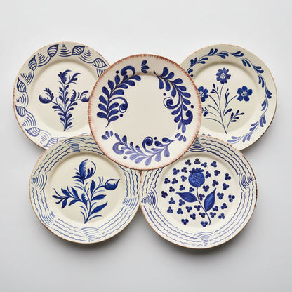 Set of 5 Blue Casa Nuno ceramic dinner plates with assorted hand-painted Talavera-style patterns.