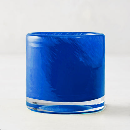 Blue votive glass candle holder, mouth-blown with unique swirls, clear base, 2.75"Dia x 2.75"H.