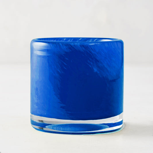 Blue votive glass candle holder, mouth-blown with unique swirls, clear base, 2.75"Dia x 2.75"H.