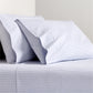 Blue Oxford Stripe Cotton Sheet Set with two pillowcases.