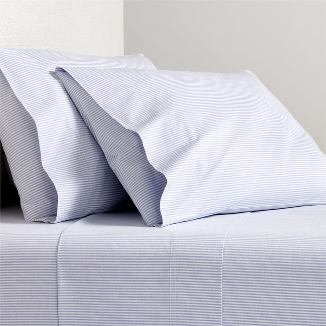 Blue Oxford Stripe Cotton Sheet Set with two pillowcases.