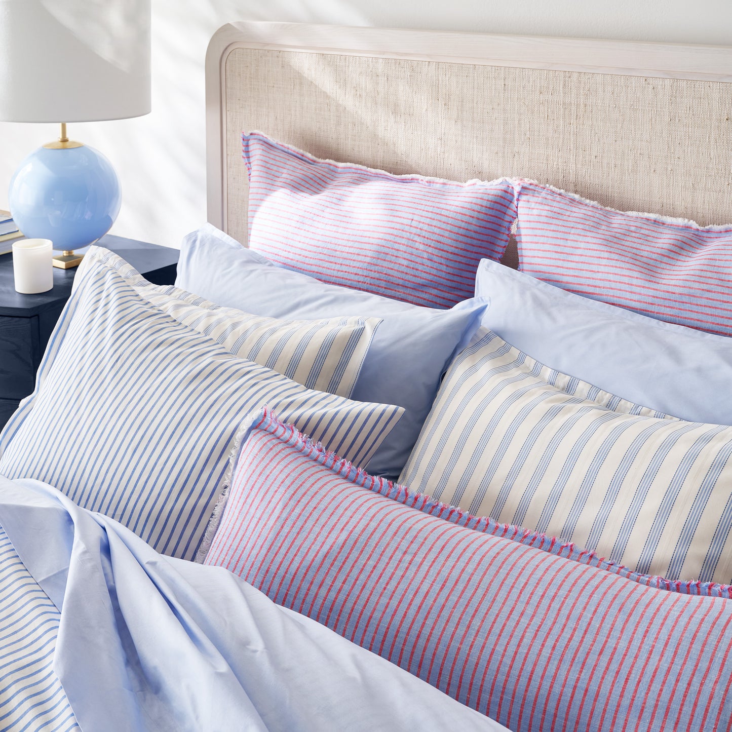 Blue Oxford Thin Stripe Cotton Duvet and Shams Set with solid blue and red striped pillows.