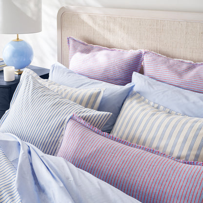 Blue Oxford Thin Stripe Cotton Duvet and Shams Set with solid blue and red striped pillows.