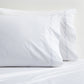 White percale pillowcases with blue scallop stitching, set of 2.