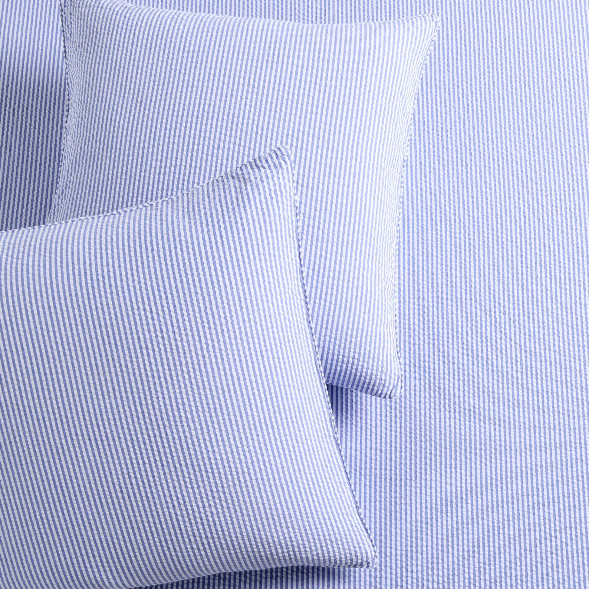 Set of 2 Blue Seersucker Stripe Organic Cotton Euro Shams with envelope closures.