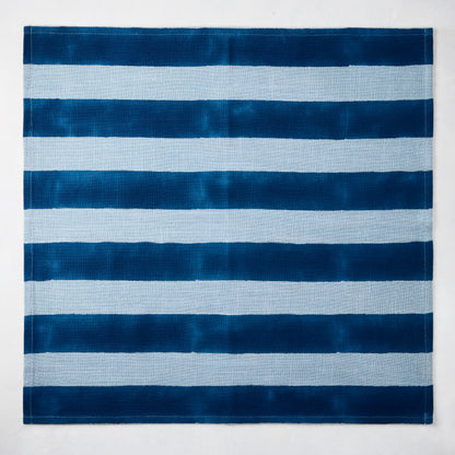 Blue Tonal Hampton Stripe Cotton Napkin, 22" square, with bold and light blue horizontal stripes.