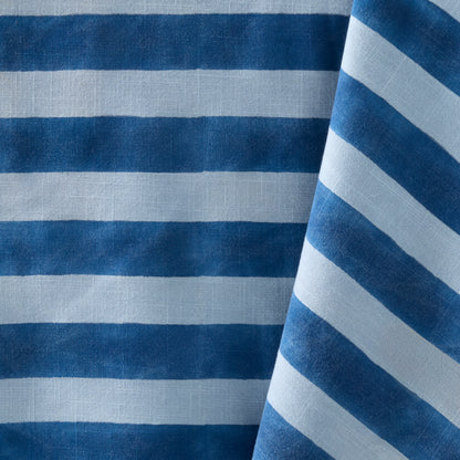 Blue Tonal Hampton Stripe Cotton Tablecloth with bold blue and light blue stripes.