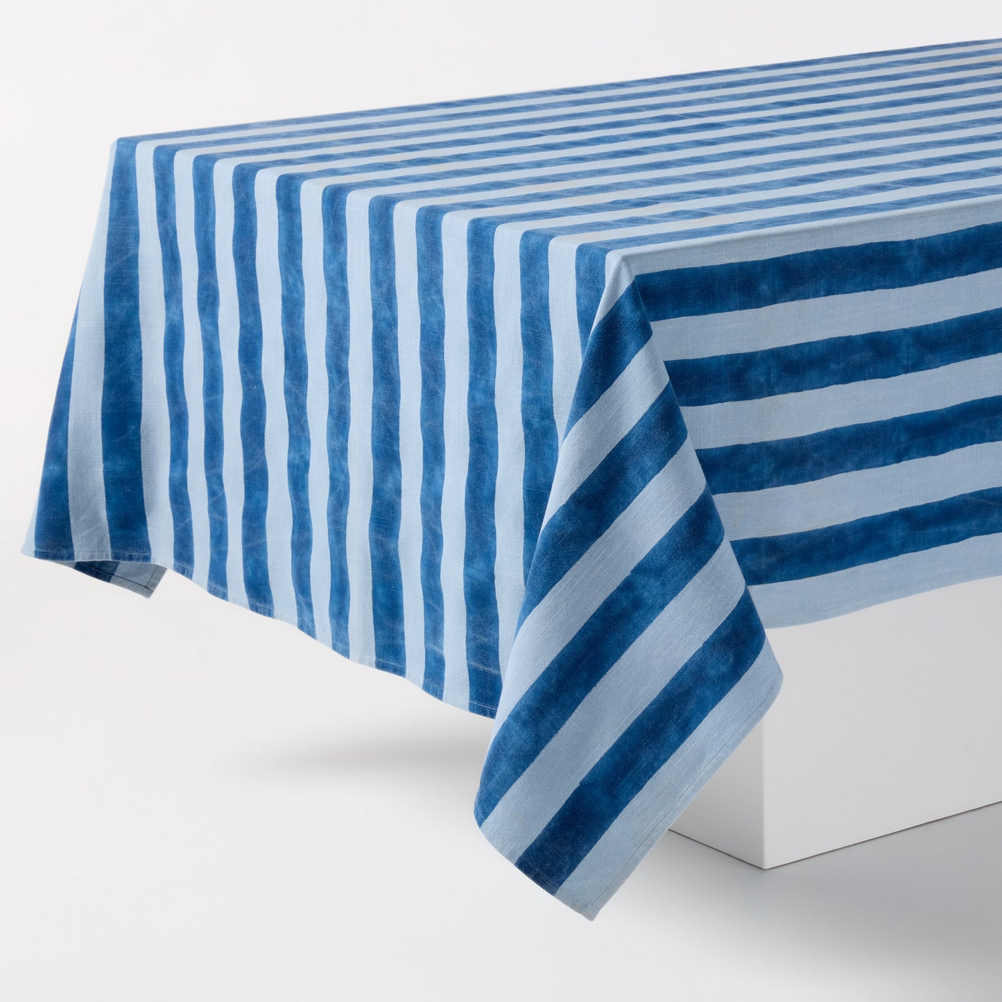 Blue Tonal Hampton Stripe Cotton Tablecloth, 70"W x 108"L, with bold blue and light blue stripes.