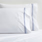 Set of two white percale pillowcases with blue triple-stitch detail.
