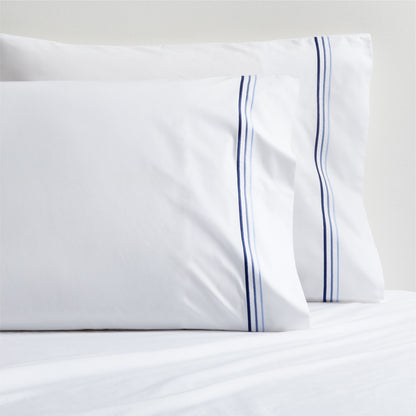 Set of two white percale pillowcases with blue triple-stitch detail.