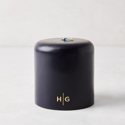 HG Blue Unscented 4x4 pillar candle, hand-dipped paraffin, with gold embossed HG logo and oversized cotton wick.