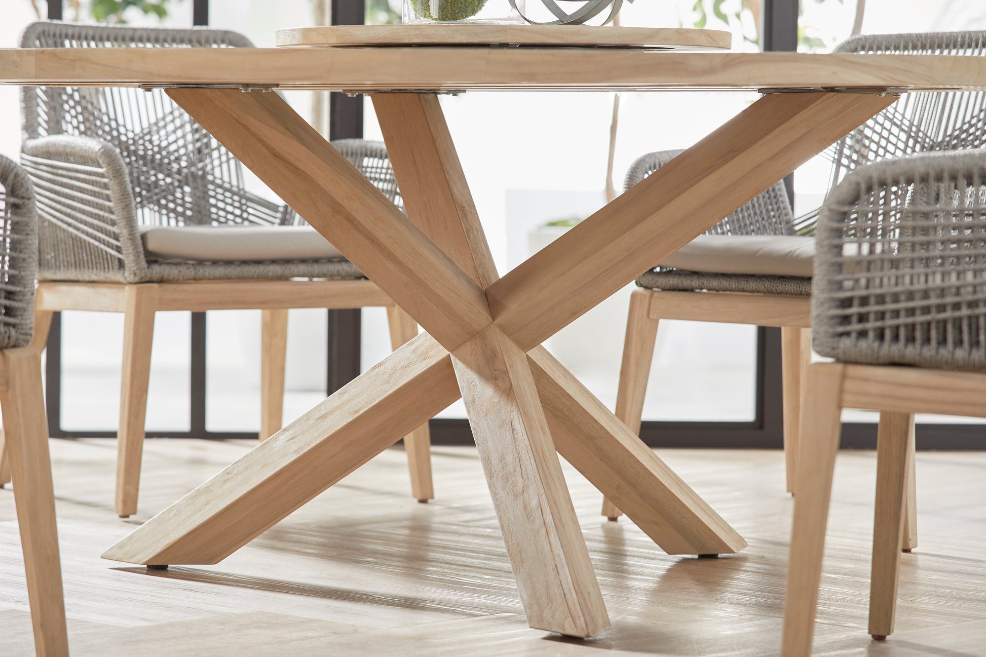 Boca Outdoor Round Dining Table, 63", natural solid teak wood with a unique X-base design.