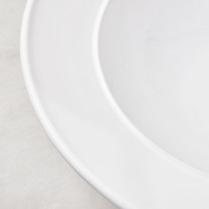 Bolinas white ceramic serve bowl with a raised edge trim, handmade in Italy.