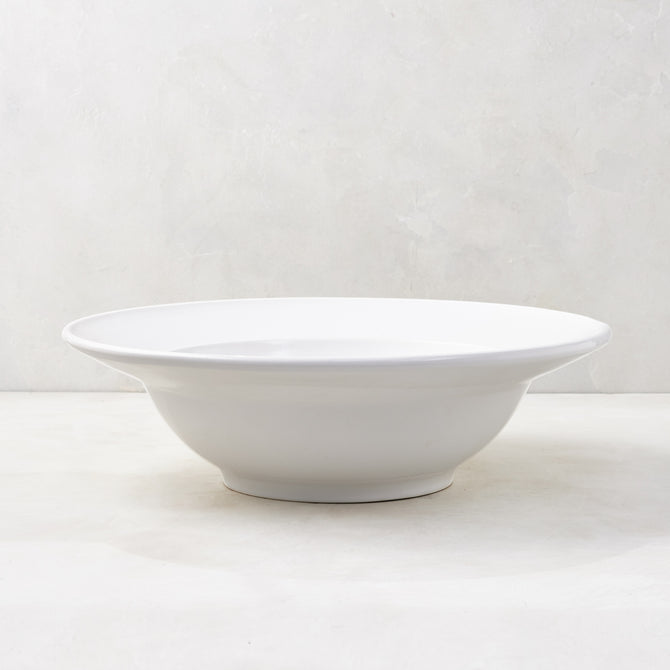 Bolinas 16" white ceramic serve bowl with a raised edge trim, handmade in Italy.