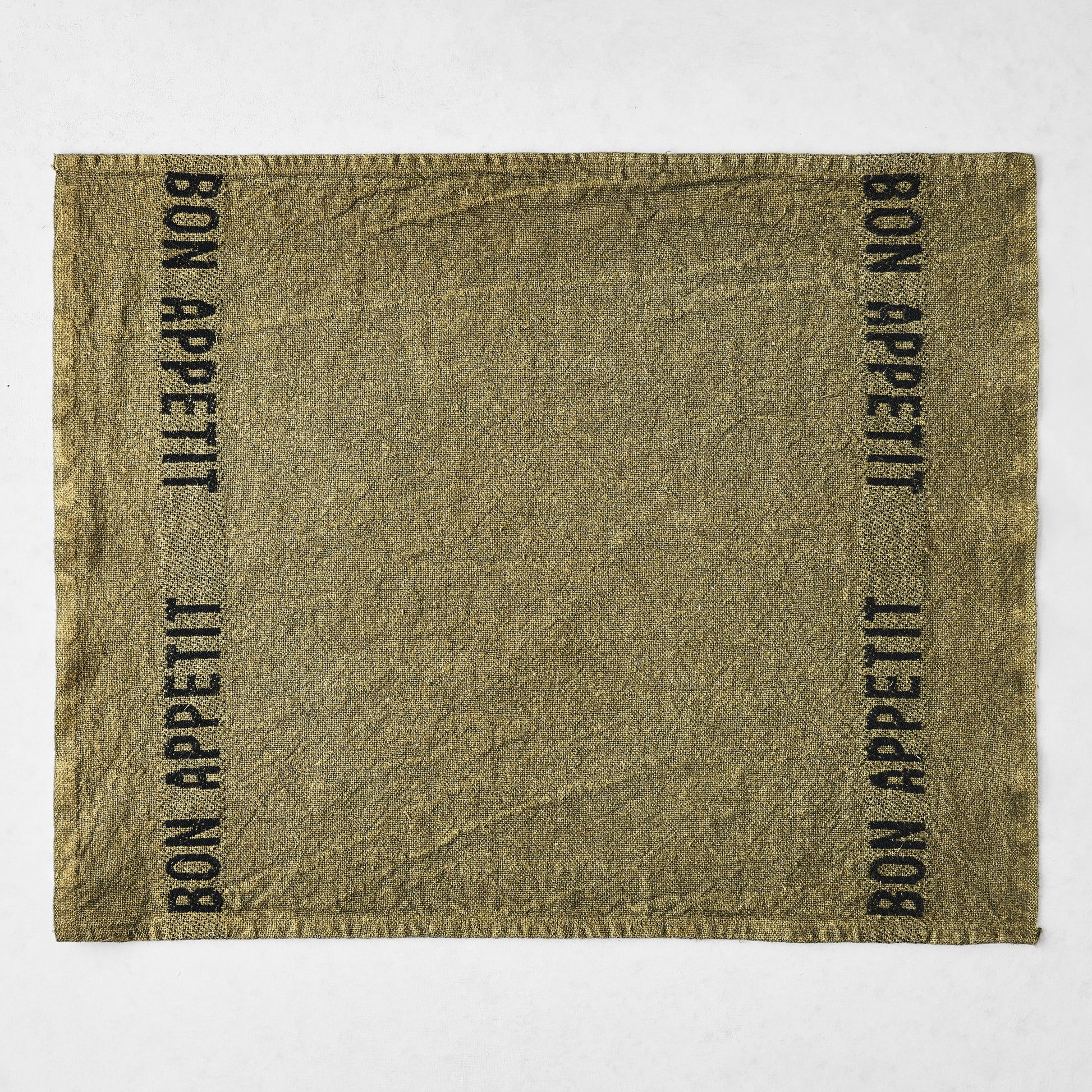 Avocat green linen napkin with "BON APPETIT" in black lettering, 14"L x 18"W.