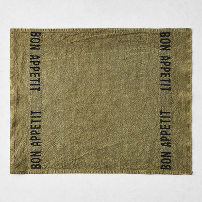 Avocat green linen napkin with "BON APPETIT" in black lettering, 14"L x 18"W.