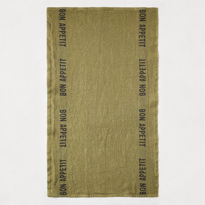 Set of 2 "Bon Appetit" dark green linen hand towels with black lettering, folded.