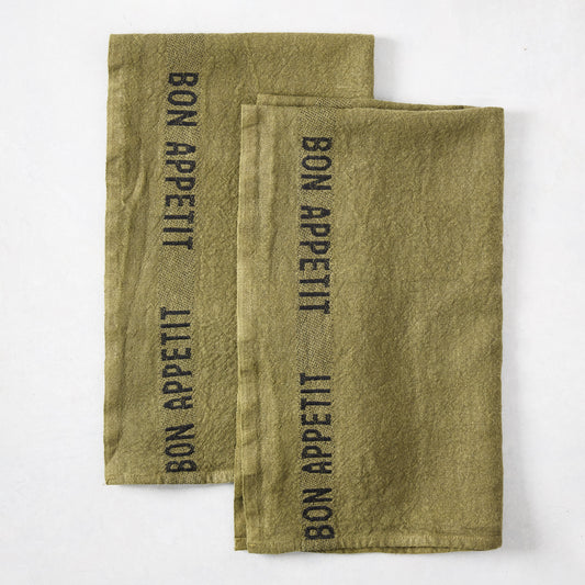 Set of 2 dark green linen hand towels with "BON APPETIT" in black lettering.